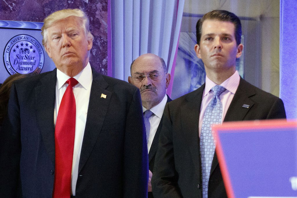 Allen Weisselberg, flanked by Donald Trump and Donald Trump Jr.