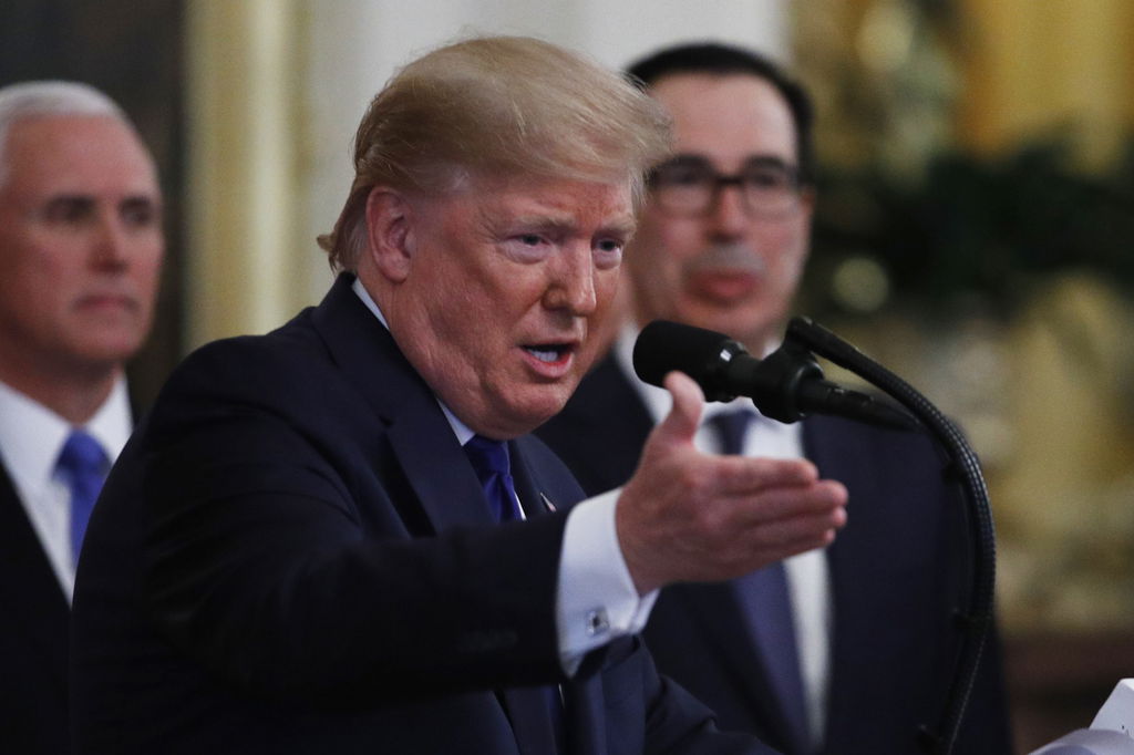 President Donald Trump prepares to sign a U.S.-China trade agreement at the White House.